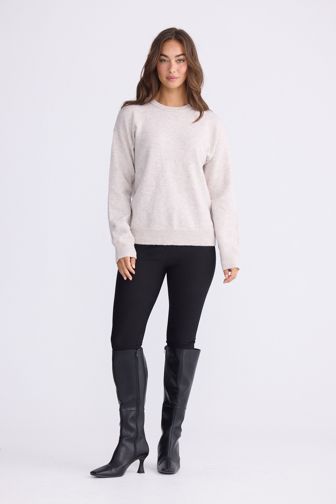 Model wearing Casey Knit - Oat, alternate studio view on white background