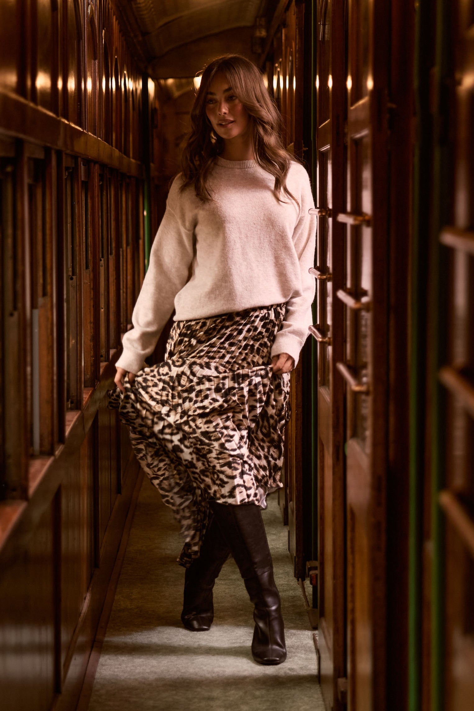 Model wearing Casey Knit - Oat, campaign view on white background