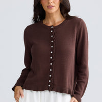 Model wearing Lorrie Frill Cardi in chocolate brown by Brave + True, front view.