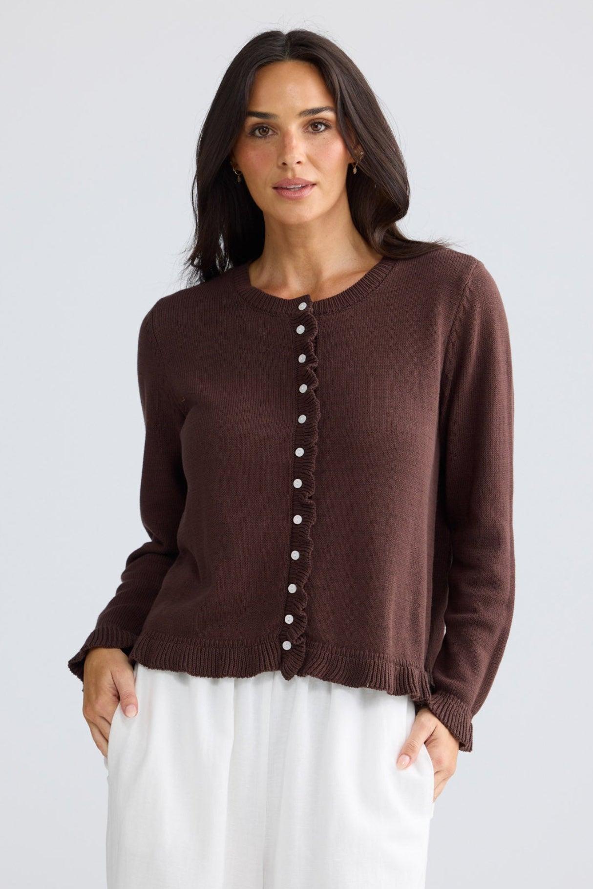 Model wearing Lorrie Frill Cardi in chocolate brown by Brave + True, front view.