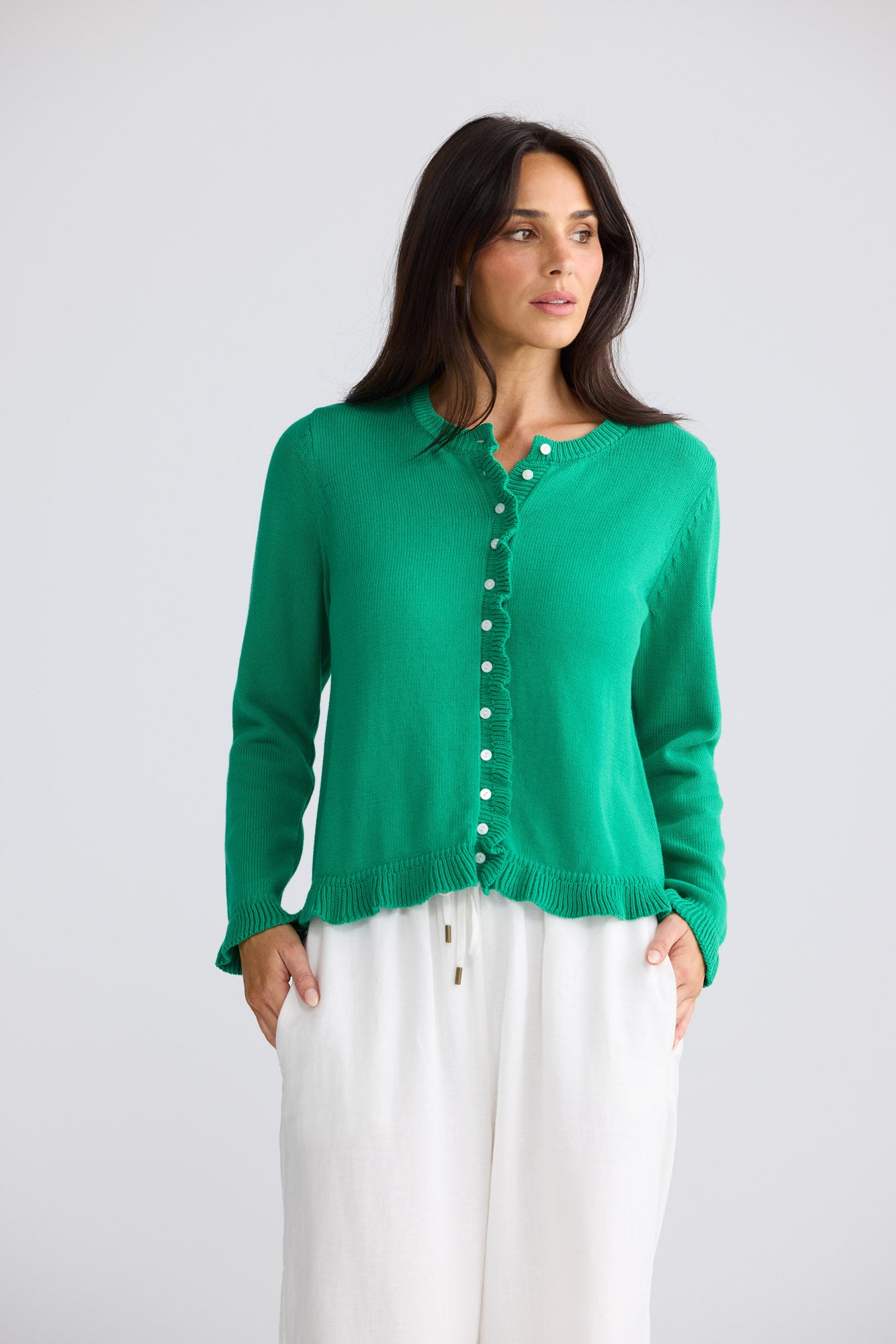 Model wearing Lorrie Frill Cardi in Jade by Brave + True, view 3.
