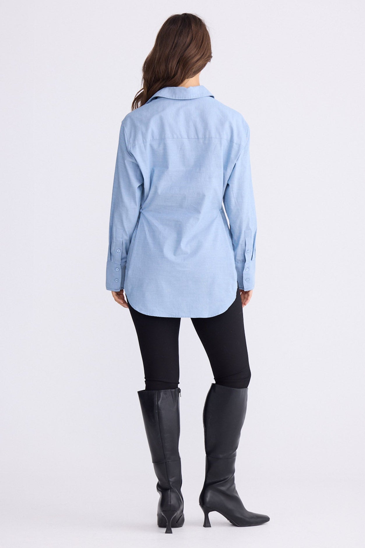 Model wearing Perry Shirt in blue with collar, front view on white background