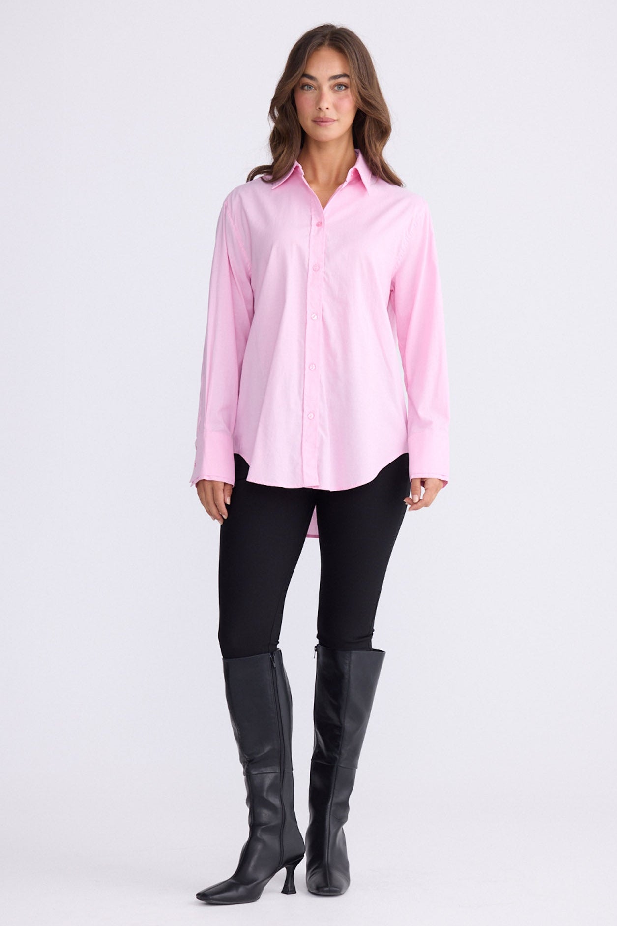 Model wearing Perry Shirt in pink with collar, front view on white background