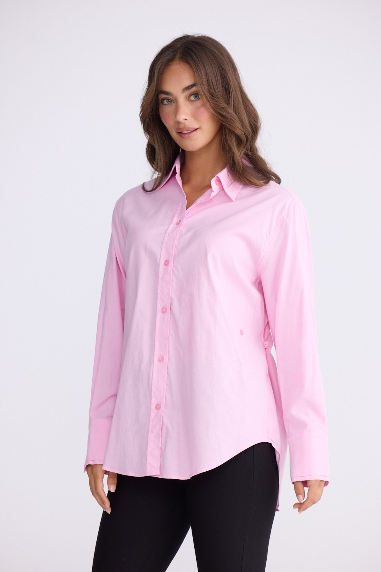 Model wearing Perry Shirt in pink with collar, front view on white background