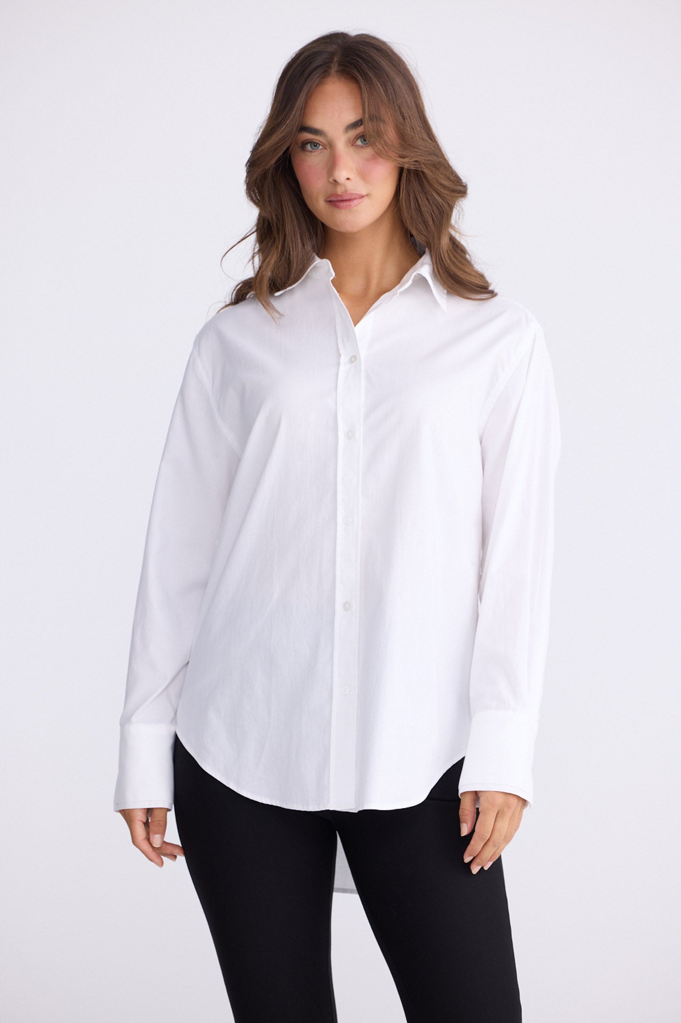 Model wearing Perry Shirt in white with collar, back view on white background