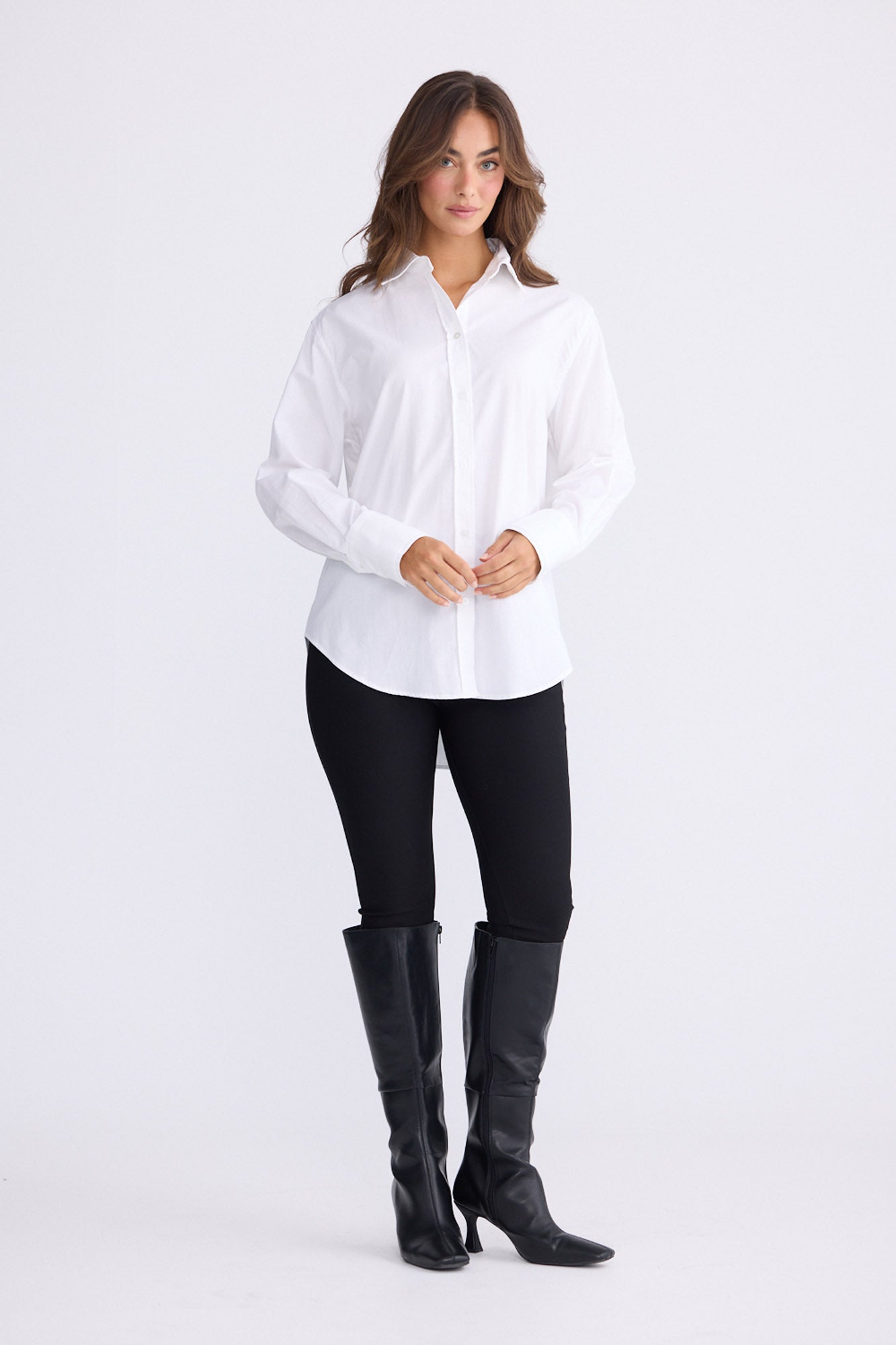 Model wearing Perry Shirt in white with collar, front view on white background