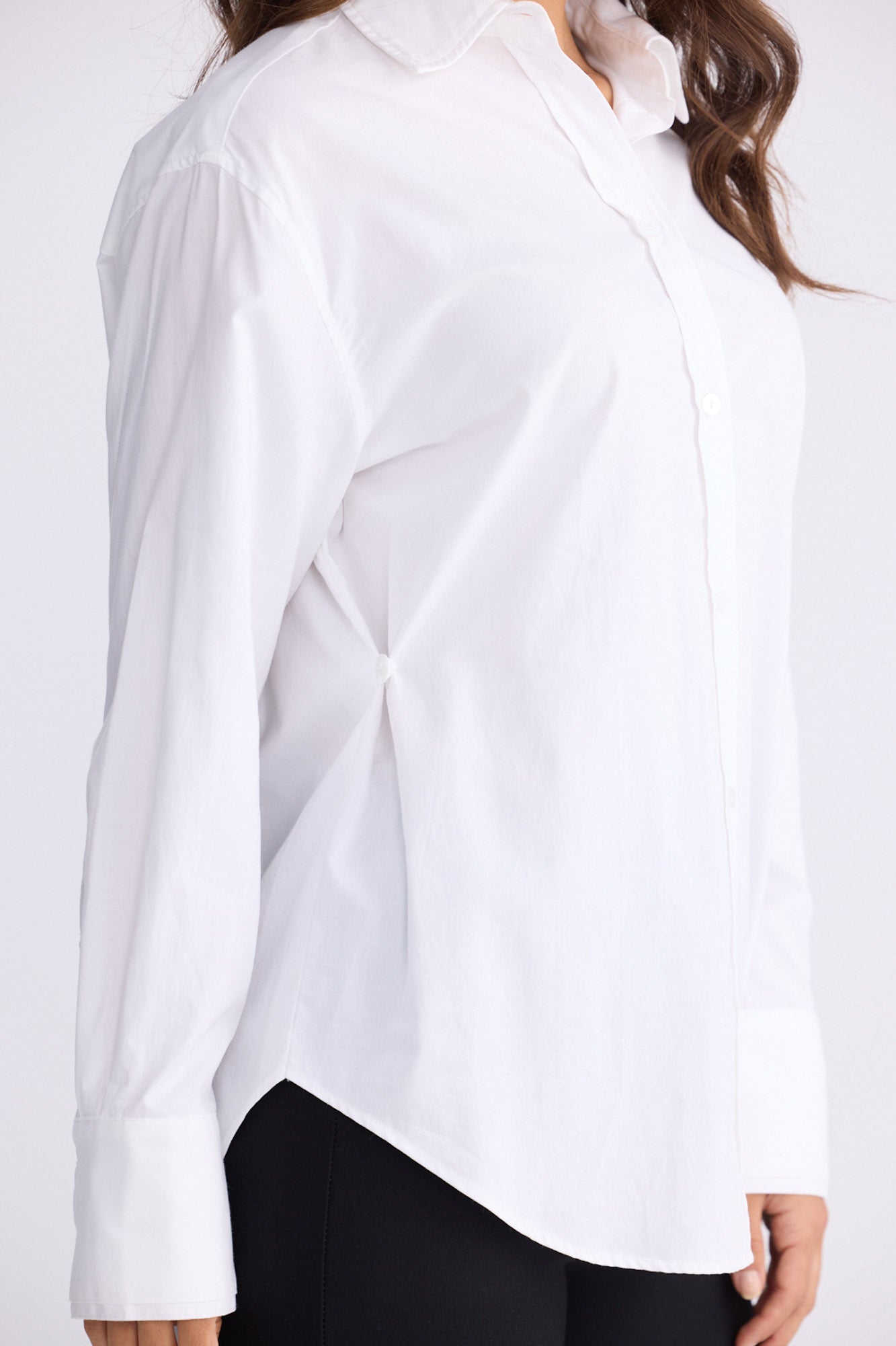Model wearing Perry Shirt in white with collar, front view on white background