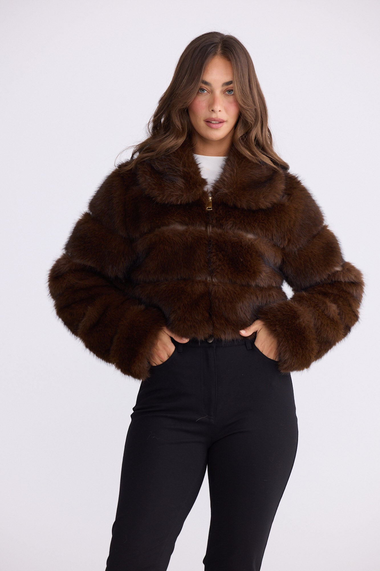 Model wearing Daria Fur Jacket brown jacket, zip-through front closure, alternate studio view on white background