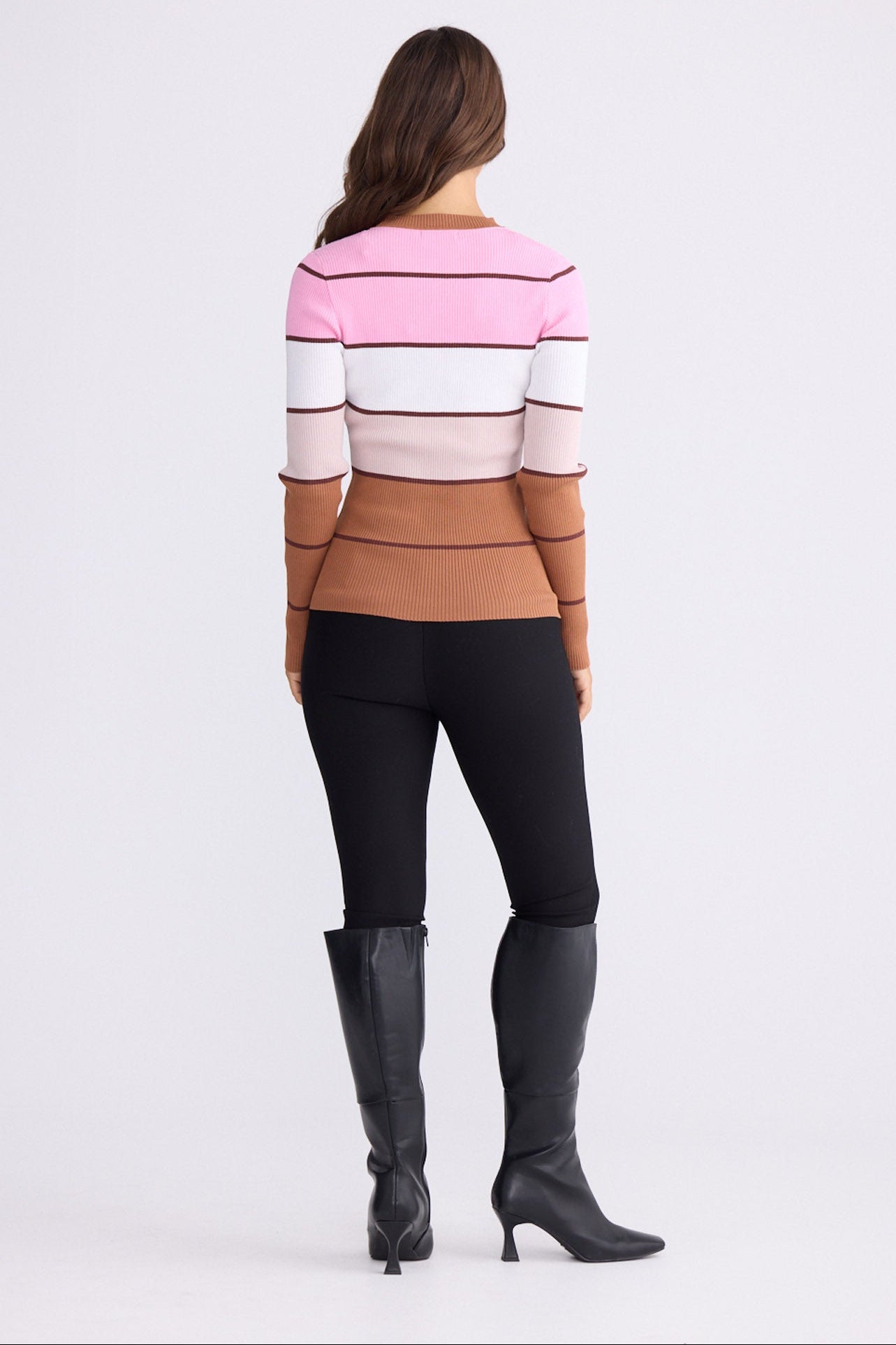 Model wearing Unley rose stripe rib knit top with fitted shape and long sleeves, alternate view on white background