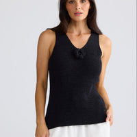 Model wearing Rosalie Knit Tank in black by Brave + True, front view showing floral motif.