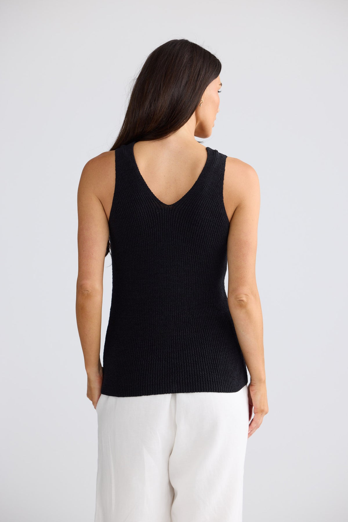 Model wearing Rosalie Knit Tank in Black by Brave + True, view 2.