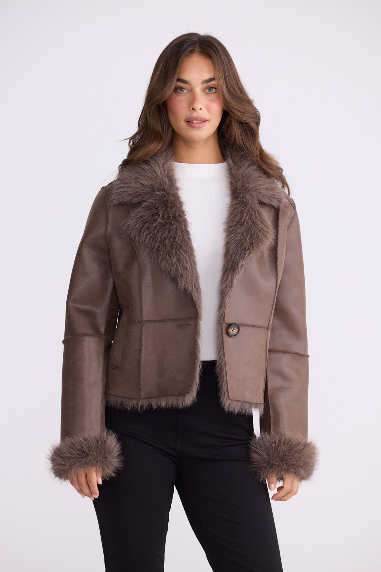 Model wearing Celia Fur Jacket - Chocolate, alternate studio view on white background