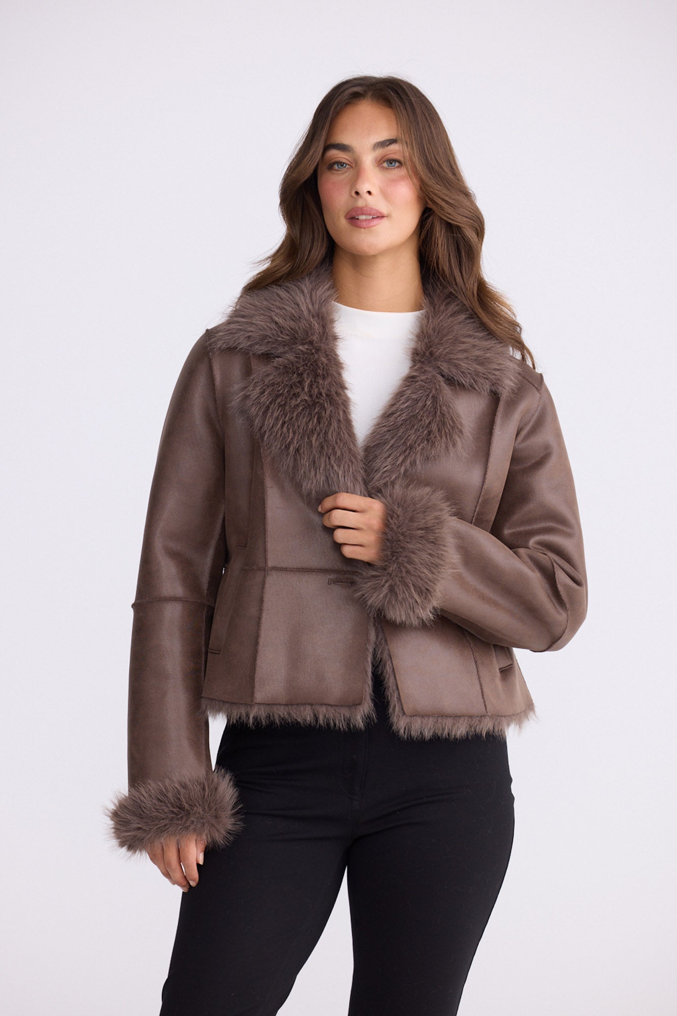 Model wearing Celia Fur Jacket - Chocolate, alternate studio view on white background