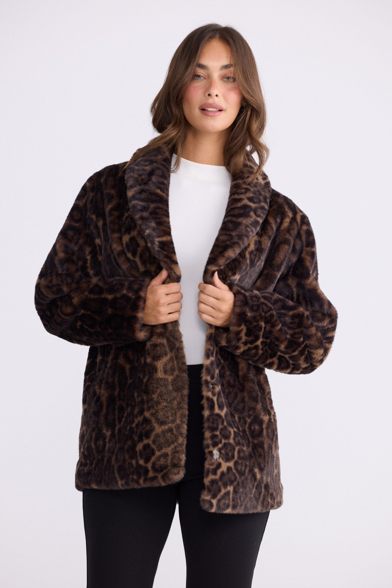 Model wearing Katerina Fur Jacket in leopard with shawl collar and long sleeves, front view on white background