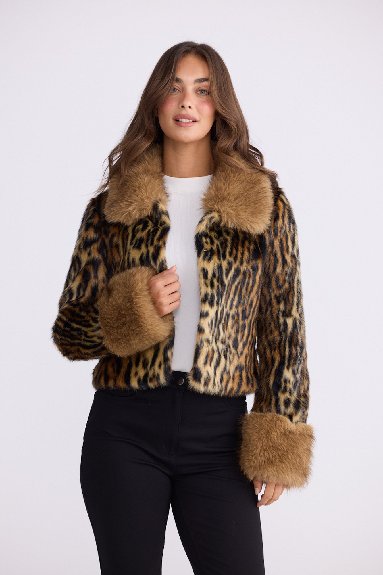 Model wearing Tatiana leopard faux fur jacket with plush collar and cuffs, alternate view on white background