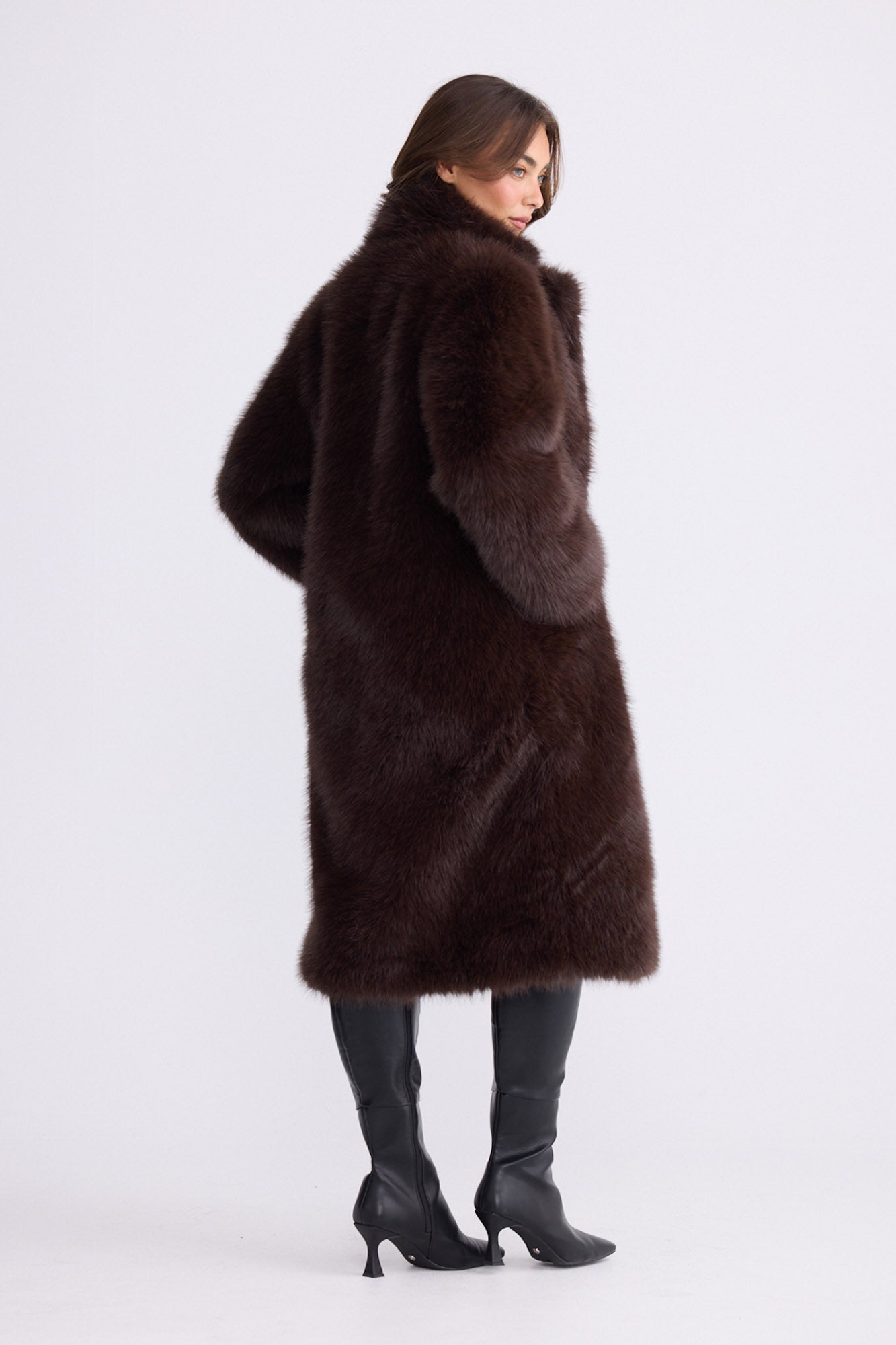 Model wearing Angela Fur Coat brown coat with notched lapel collar, alternate studio view on white background