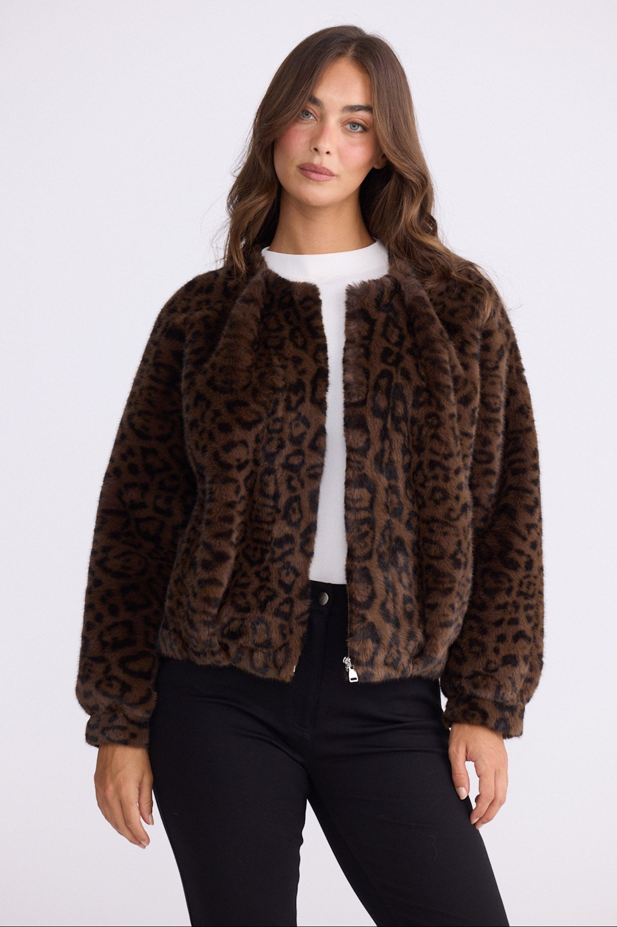 Model wearing Alya Fur Jacket brown animal-print jacket with front pockets, zip-through front closure, front view on white background