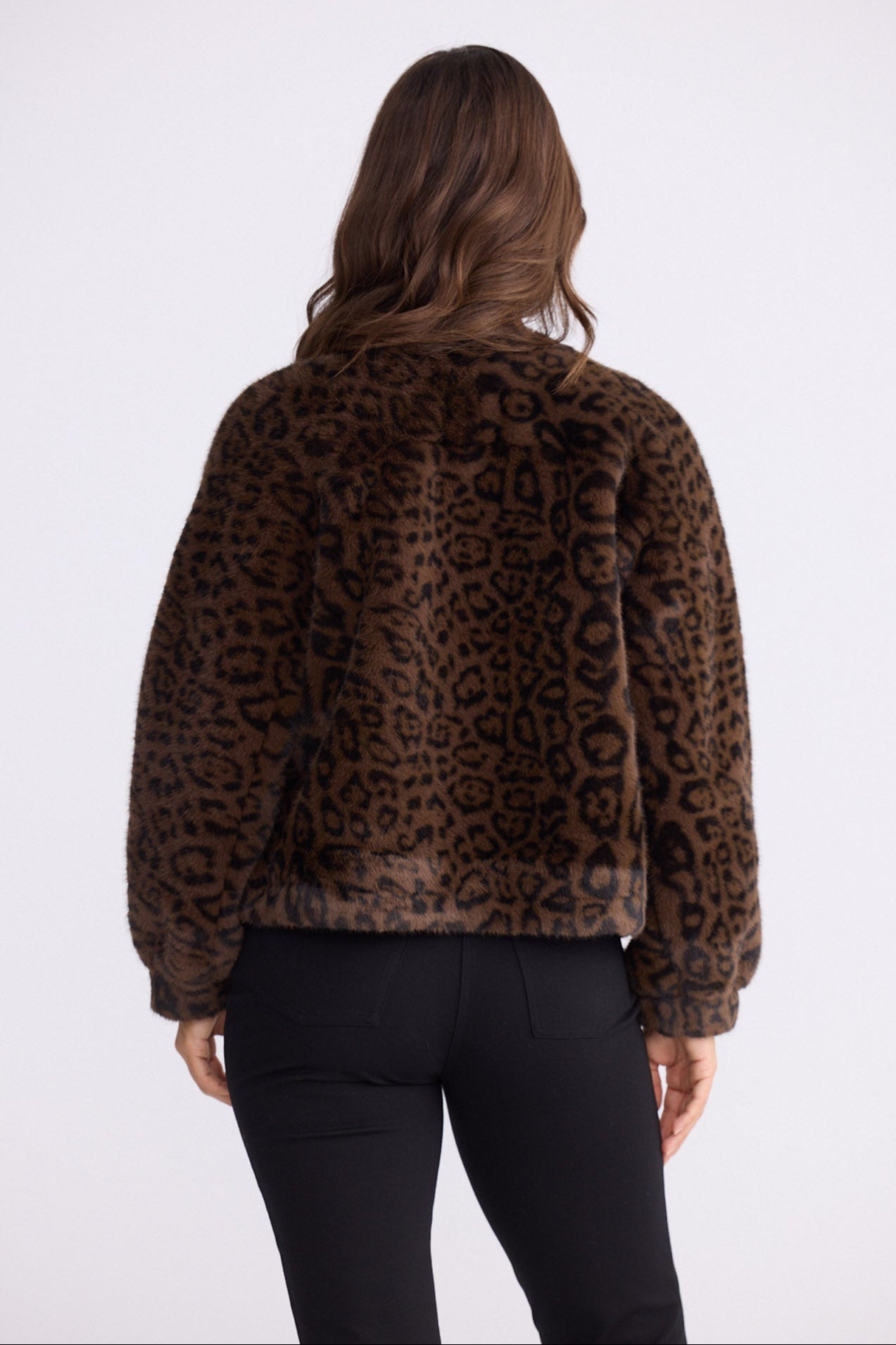 Model wearing Alya Fur Jacket brown animal-print jacket, zip-through front closure, alternate studio view on white background