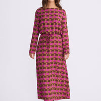 Model wearing Kensington Dress in geo prism with boat neckline and long sleeves, back view on white background