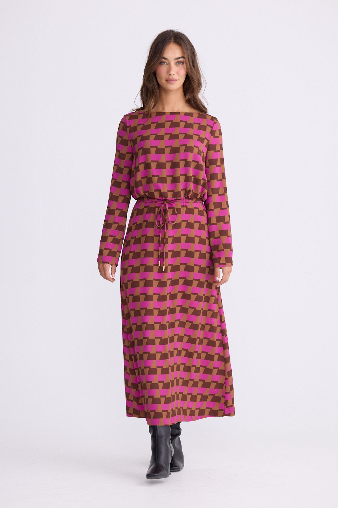 Model wearing Kensington Dress in geo prism with boat neckline and long sleeves, back view on white background