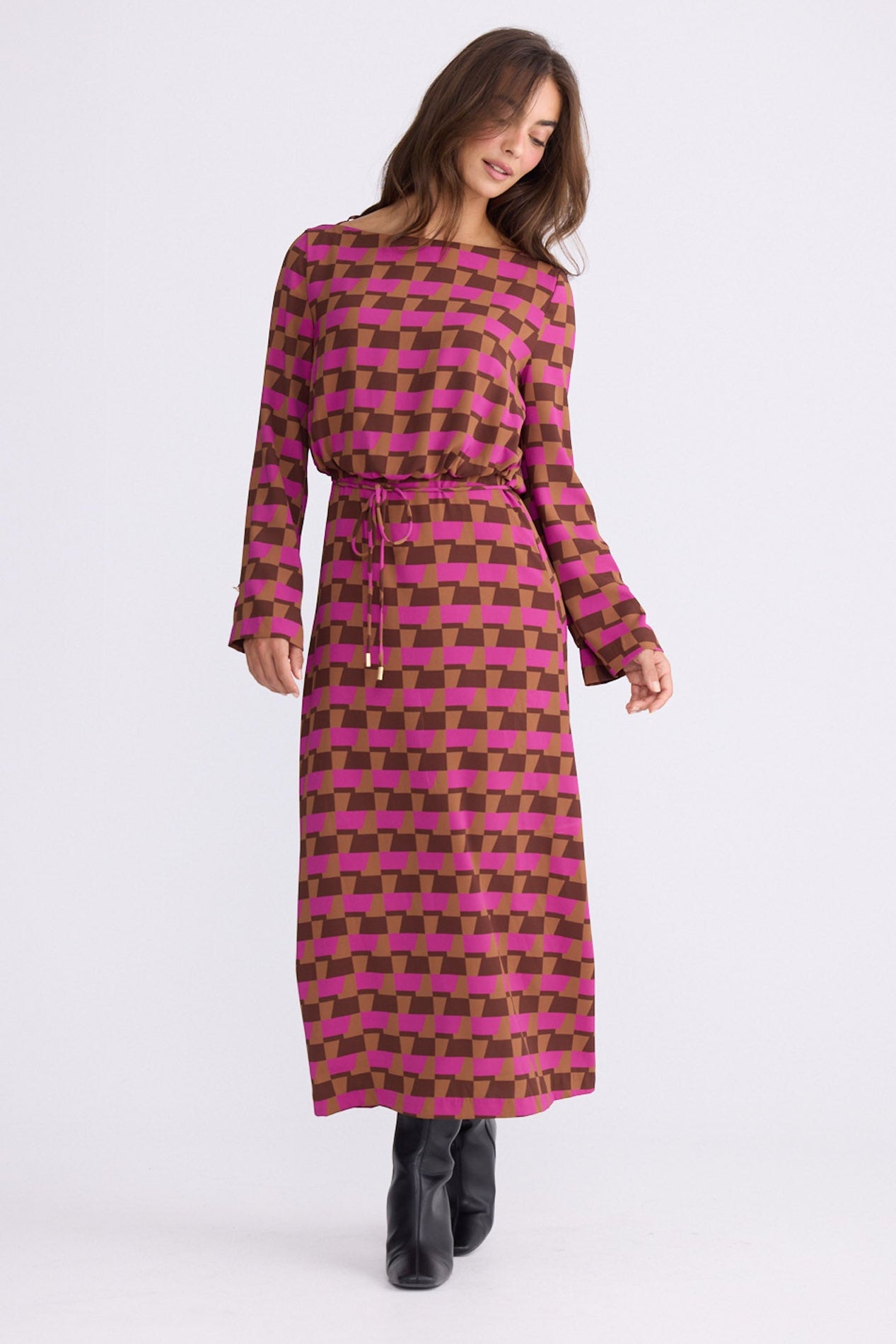 Model wearing Kensington Dress in geo prism with boat neckline and long sleeves, front view on white background