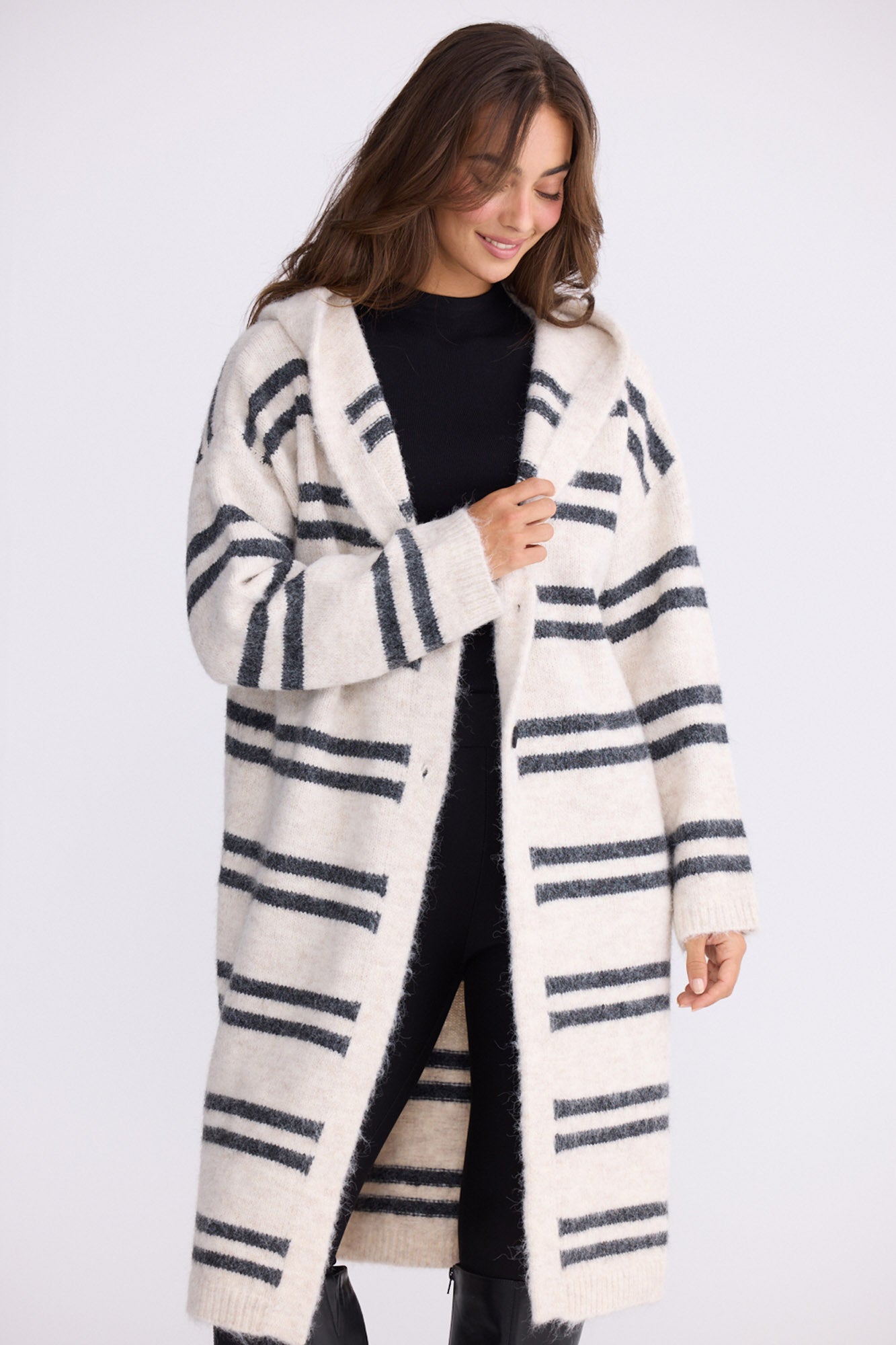 Model wearing Chelsea Knit Cardi - Natural W Grey Stripe, alternate studio view on white background