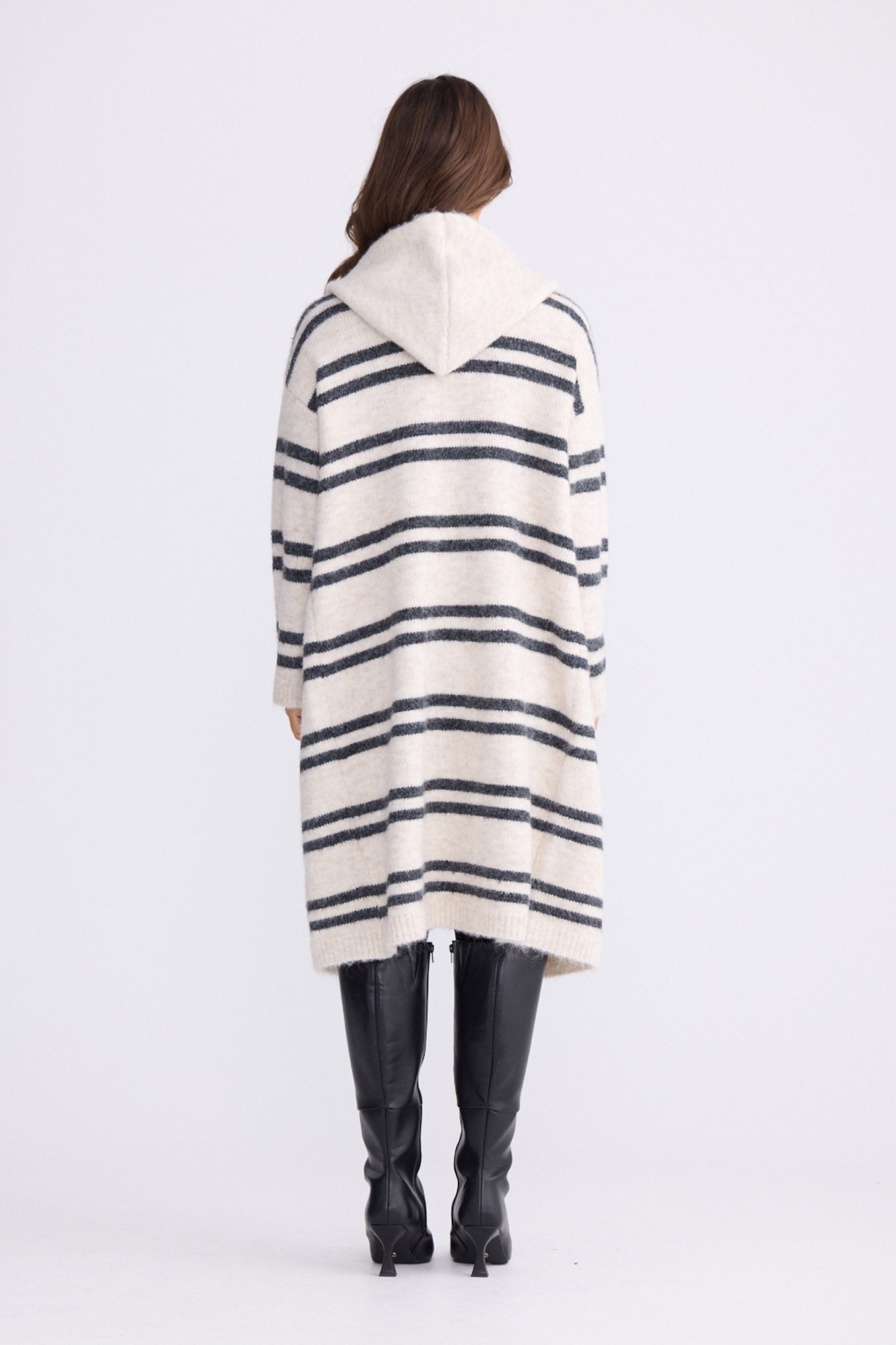 Model wearing Chelsea Knit Cardi - Natural W Grey Stripe, alternate studio view on white background