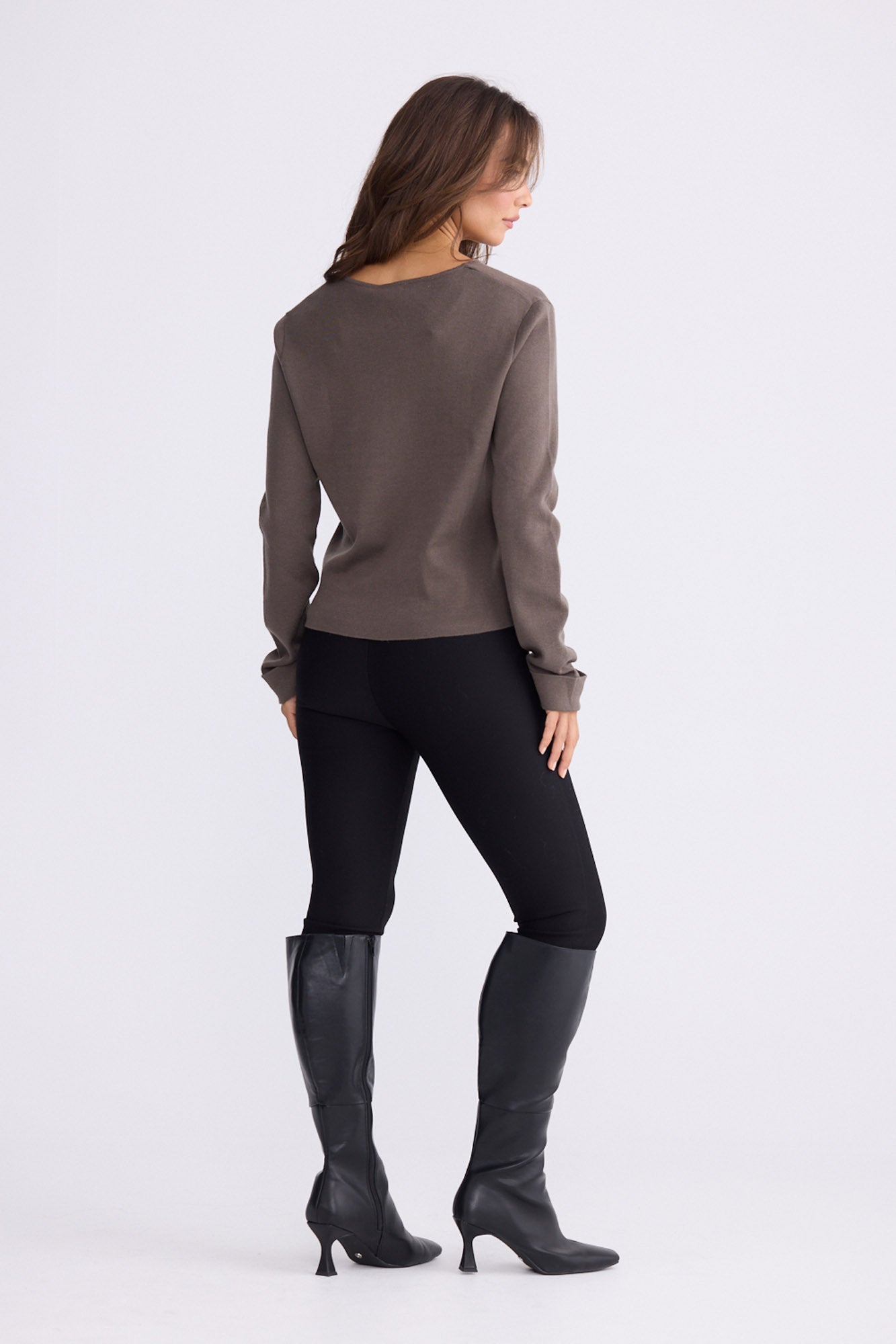 Model wearing Fitzroy Knit Top - Mushroom, alternate studio view on white background