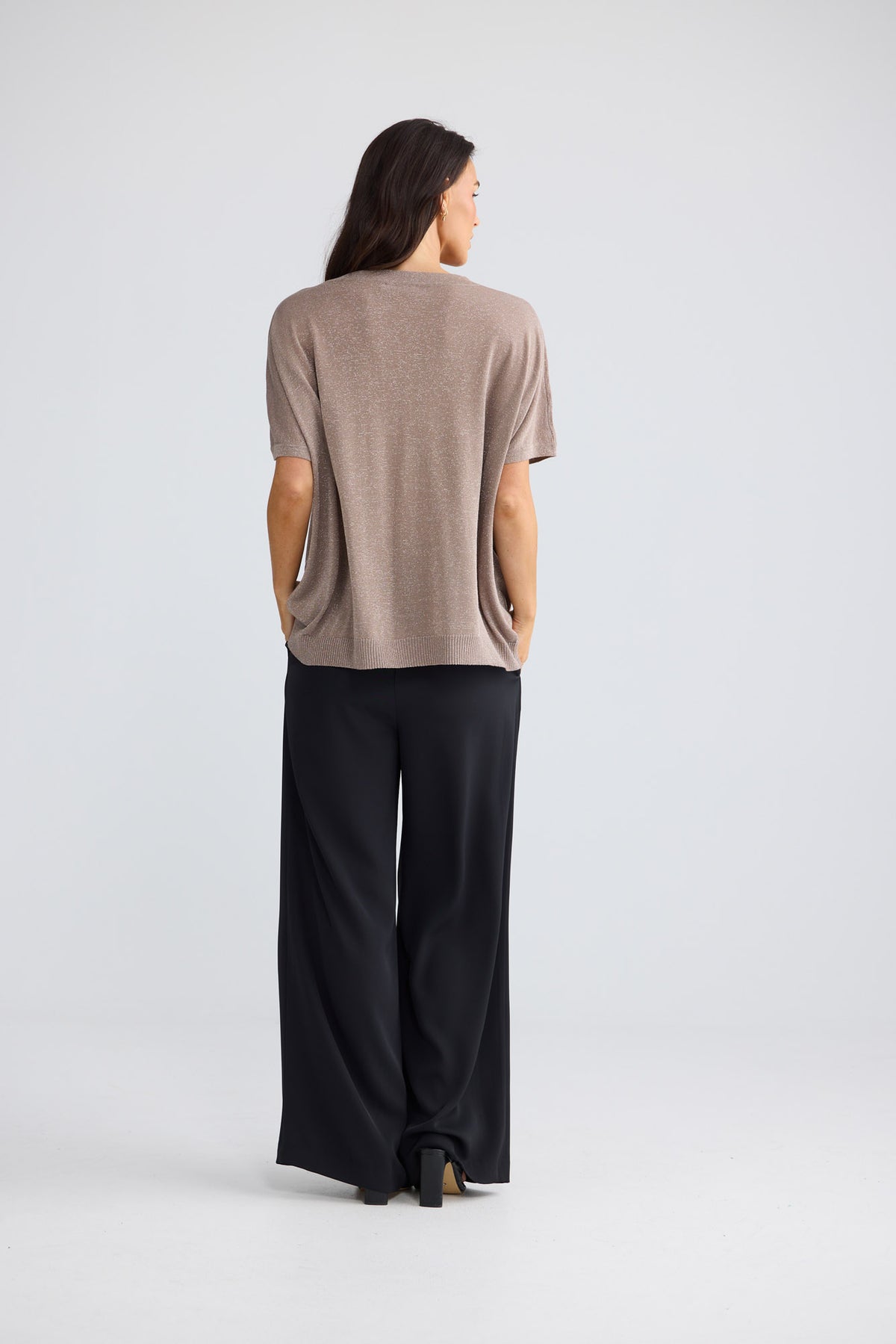 Model wearing Jessamy Top in champagne beige with silver detail by Brave + True, front view.