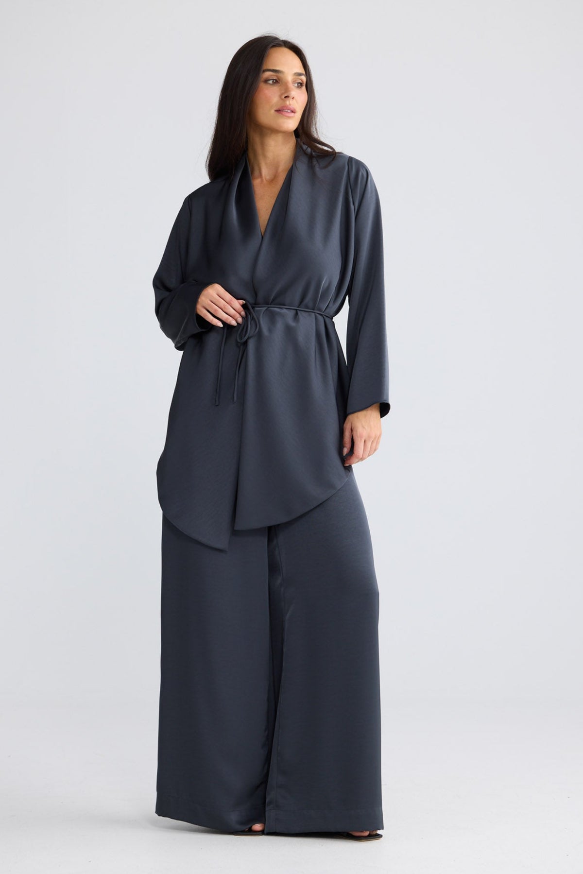 Model wearing Kaleigh Wrap Top in Graphite by Brave + True, view 2.