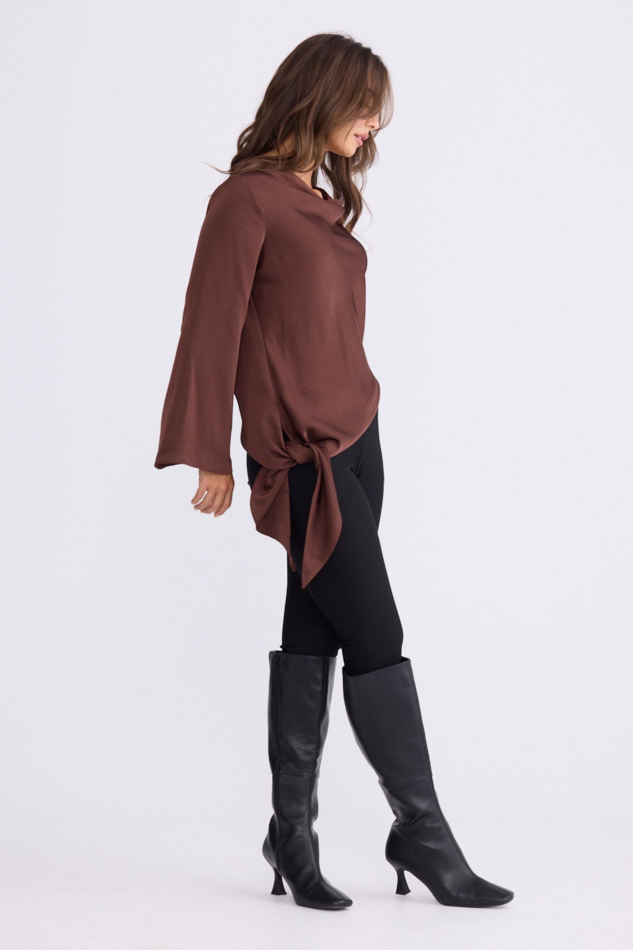 Model wearing Kirsten Top in brown, front view on white background