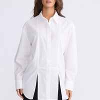 Model wearing Kara Shirt in white with collar, front view on white background