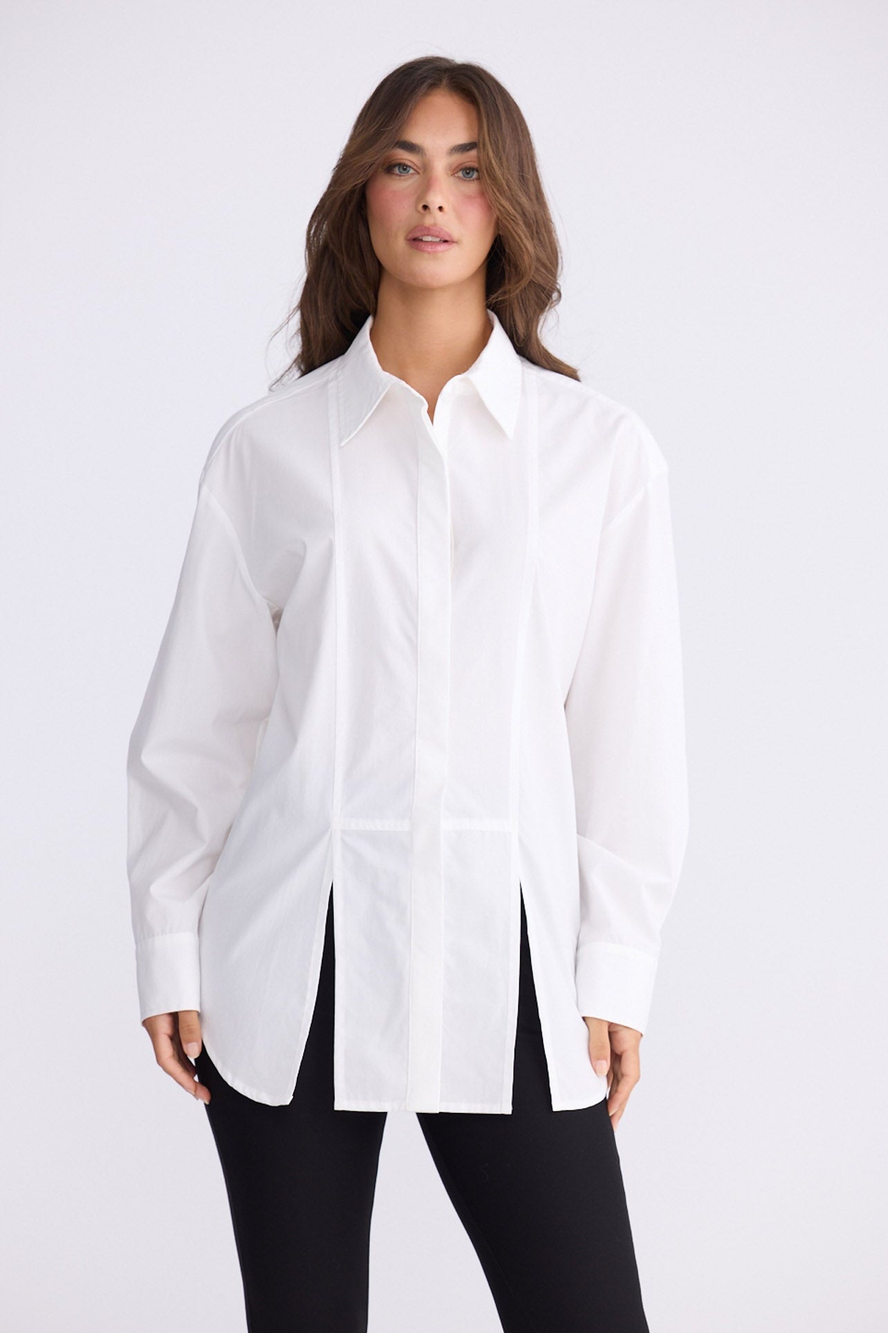 Model wearing Kara Shirt in white with collar, front view on white background