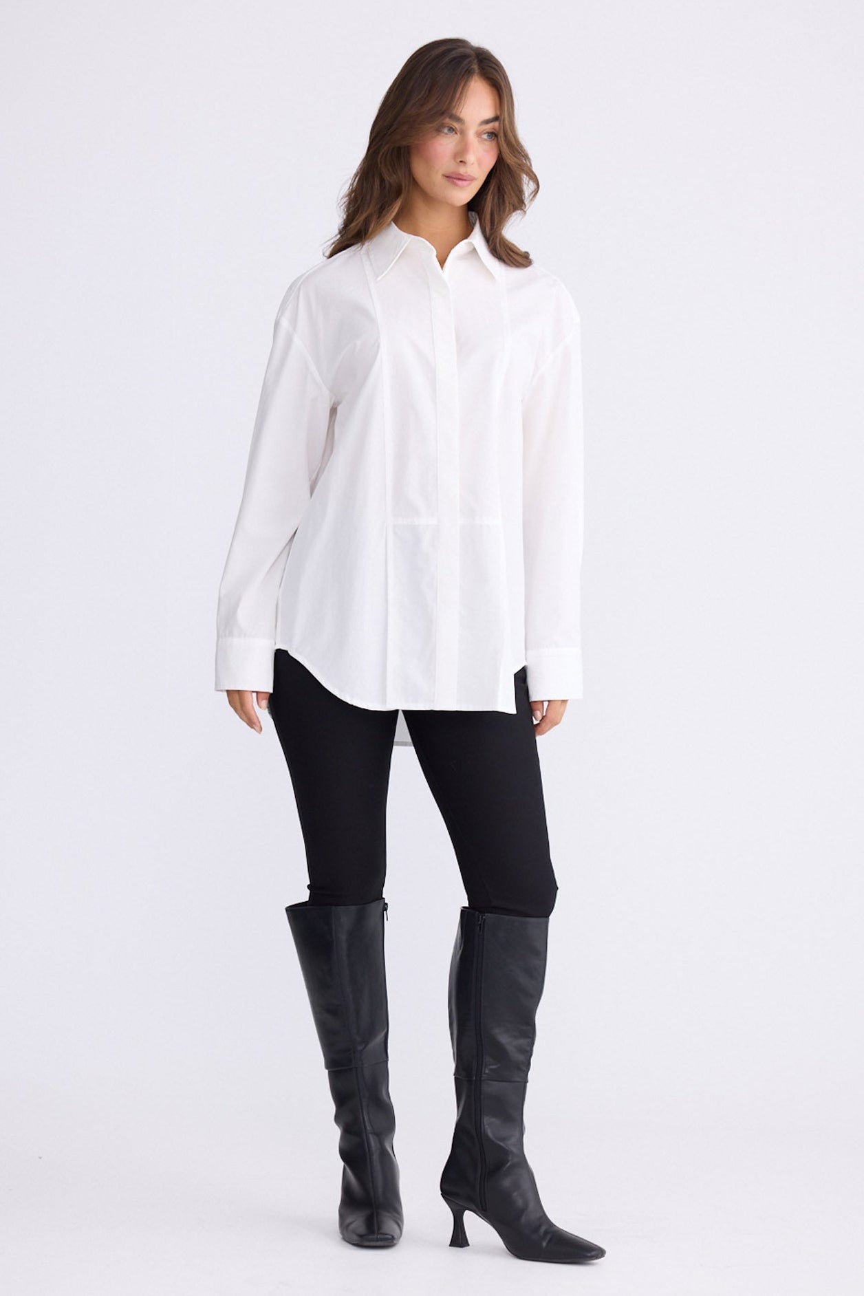Model wearing Kara Shirt in white with collar, front view on white background