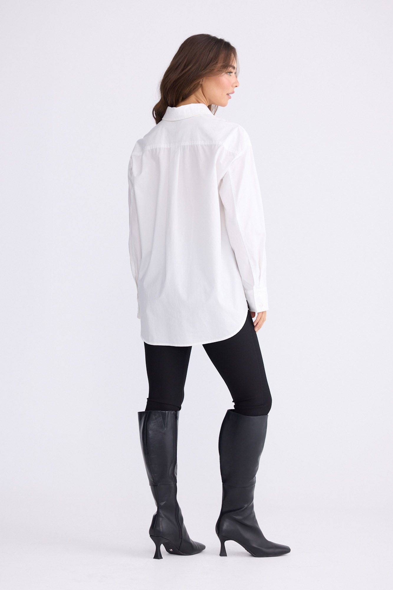 Model wearing Kara Shirt in white with collar, front view on white background