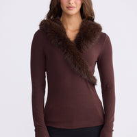 Model wearing Imelda Top in brown with V-neck and long sleeves, front view on white background