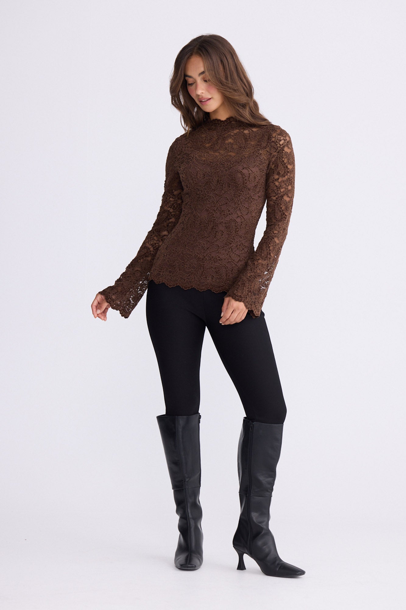 Model wearing Hollis Top in brown with high neck and long sleeves, front view on white background