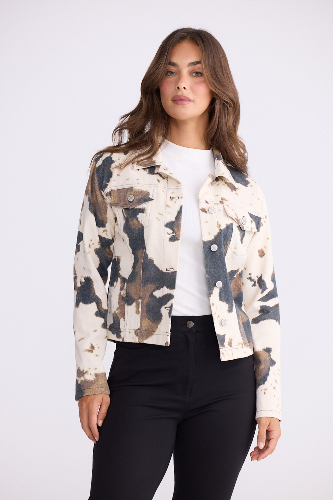 Model wearing Sidewalker Jacket in abstract cow with collar and long sleeves, back view on white background