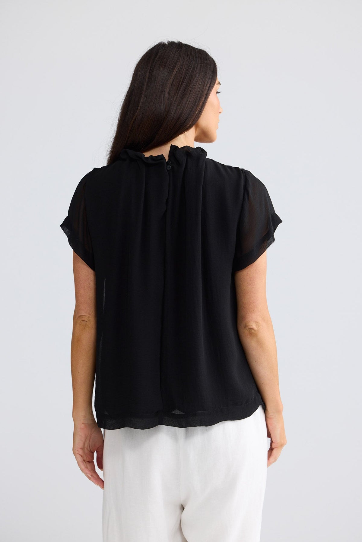 Model wearing Carina Blouse in Black by Brave + True, view 4.