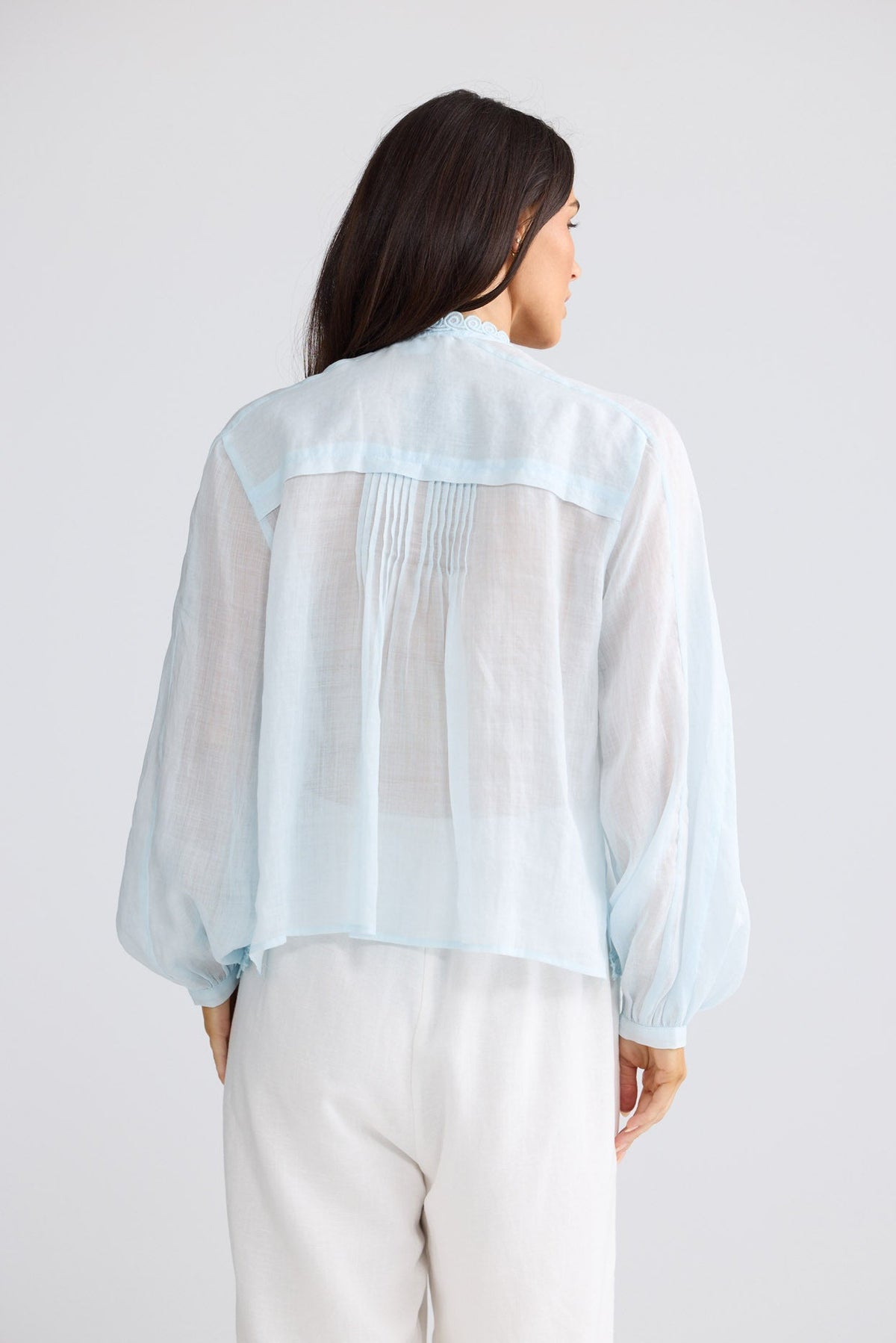 Model wearing Jenson Shirt in powder blue by Brave + True, front view showing embroidery.