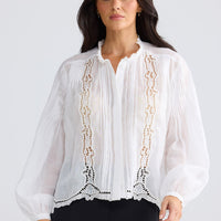Model wearing Jenson Shirt in white by Brave + True, front view showing embroidery.
