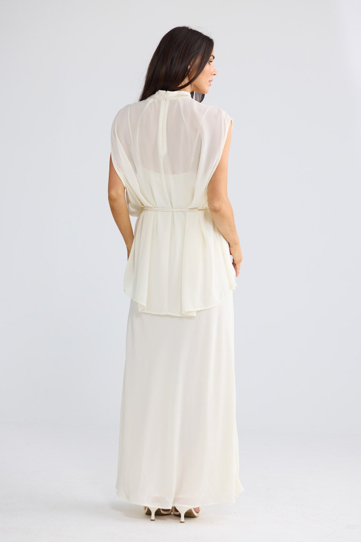 Model wearing Bethany Top in oyster beige by Brave + True, front view showing rosette tie.