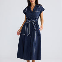 Model wearing Portia Dress in Navy W White by Brave + True, view 2.