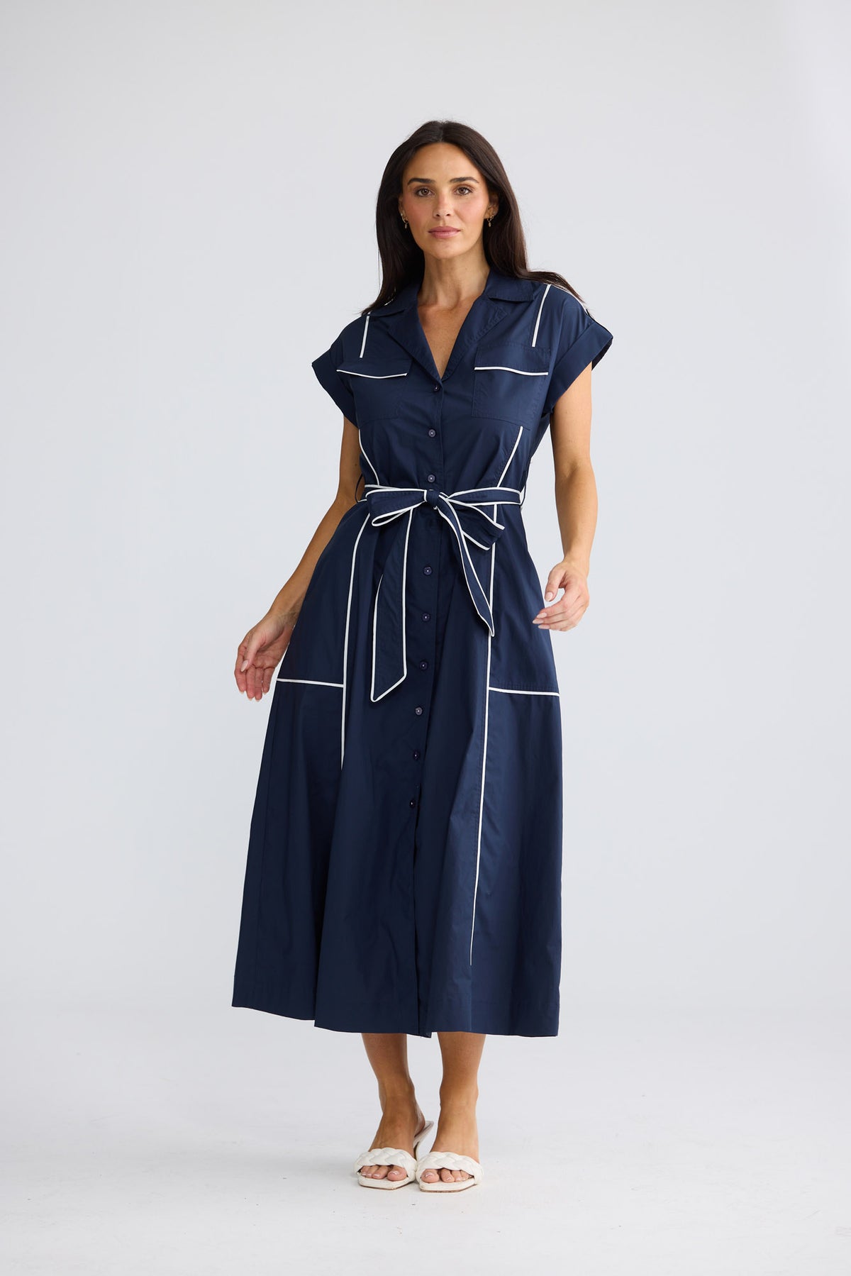 Model wearing Portia Dress in Navy W White by Brave + True, view 2.