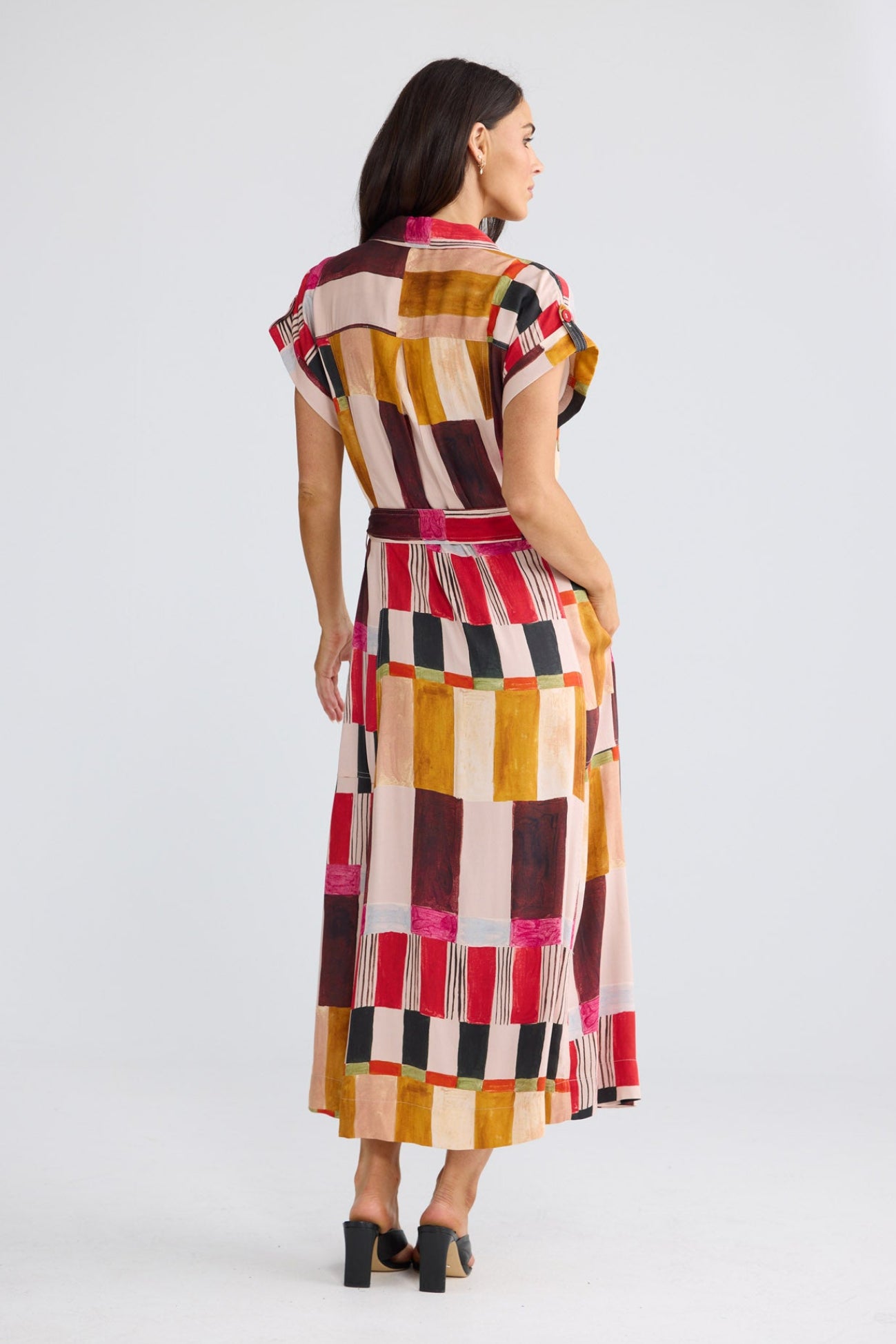 Model wearing Portia Dress in painterly geo print by Brave + True, front view.