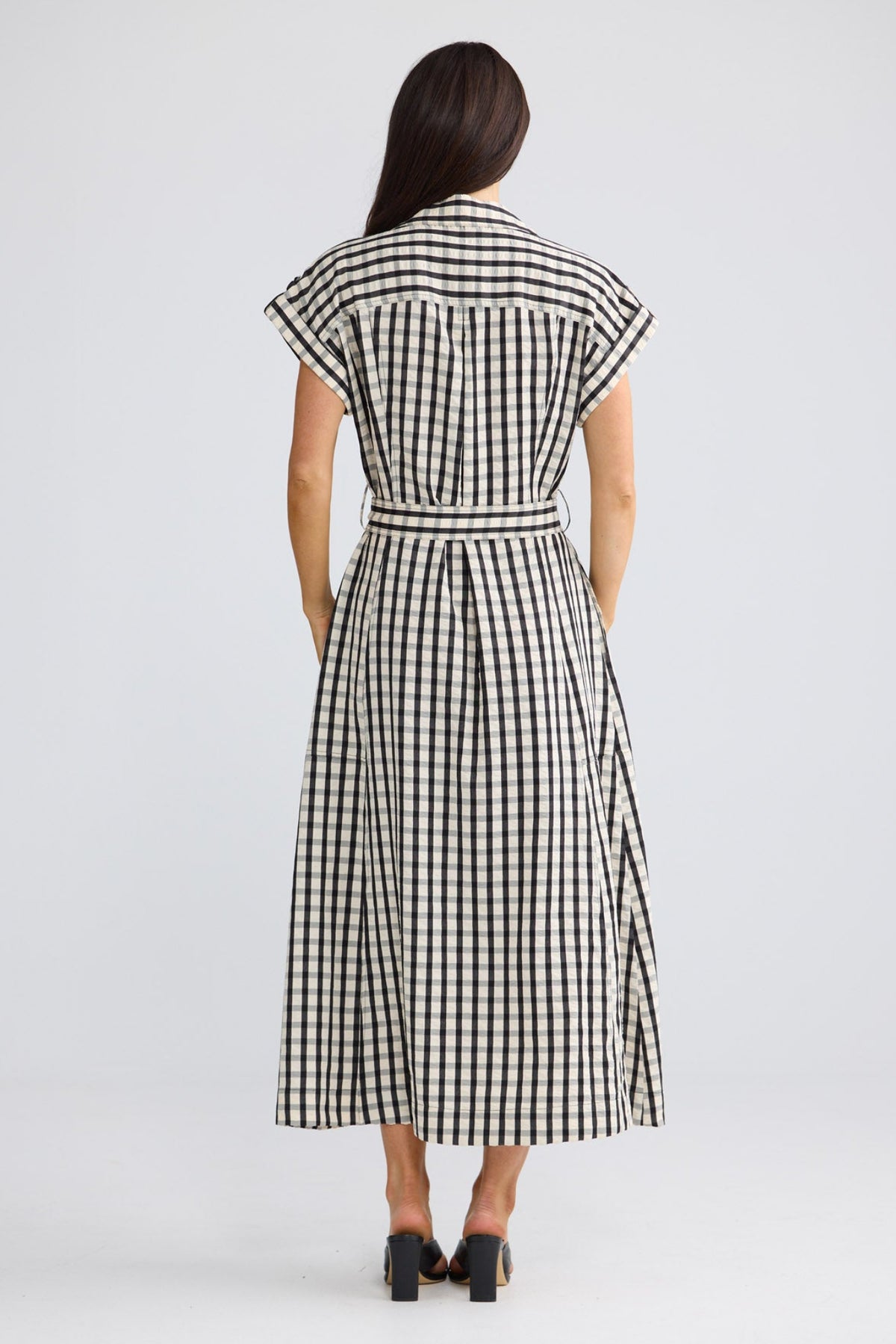 Model wearing Portia Dress in Black Gingham by Brave + True, view 2.