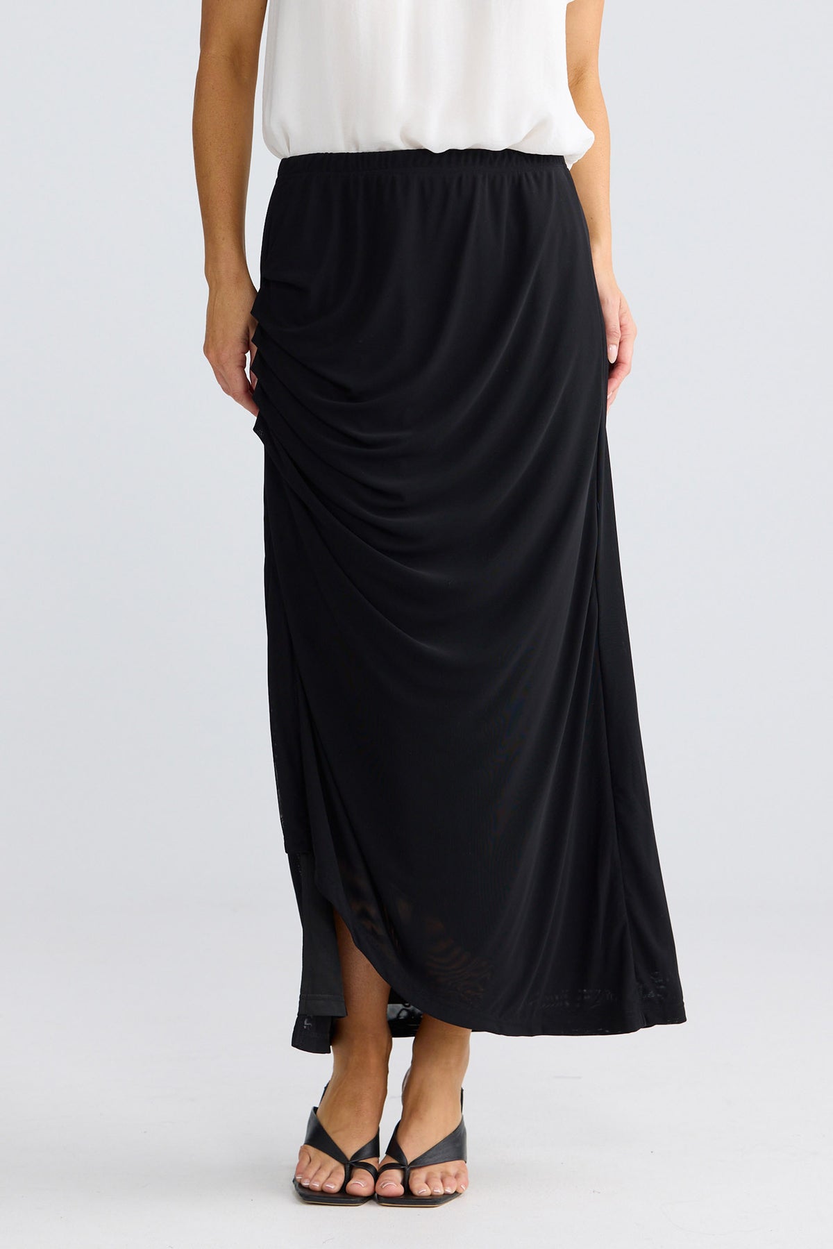Model wearing Francine Skirt in Black by Brave + True, view 2.