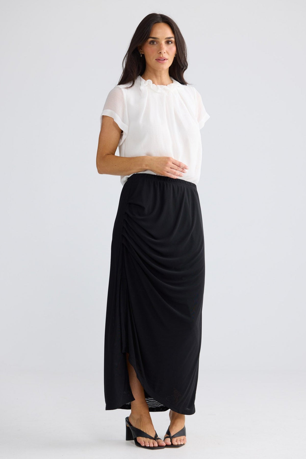 Model wearing Francine Skirt in Black by Brave + True, view 4.
