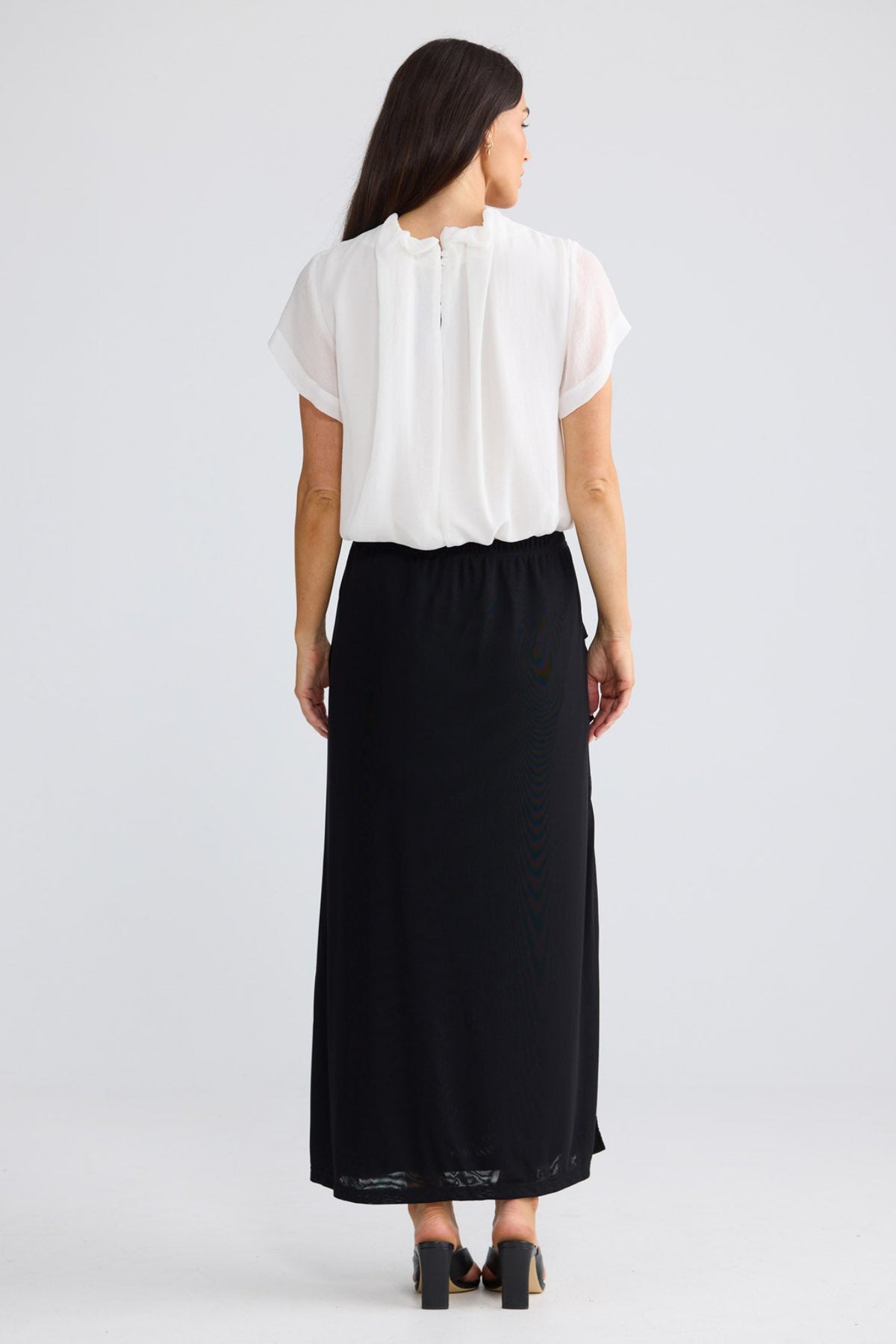 Model wearing Francine Skirt in Black by Brave + True, view 3.