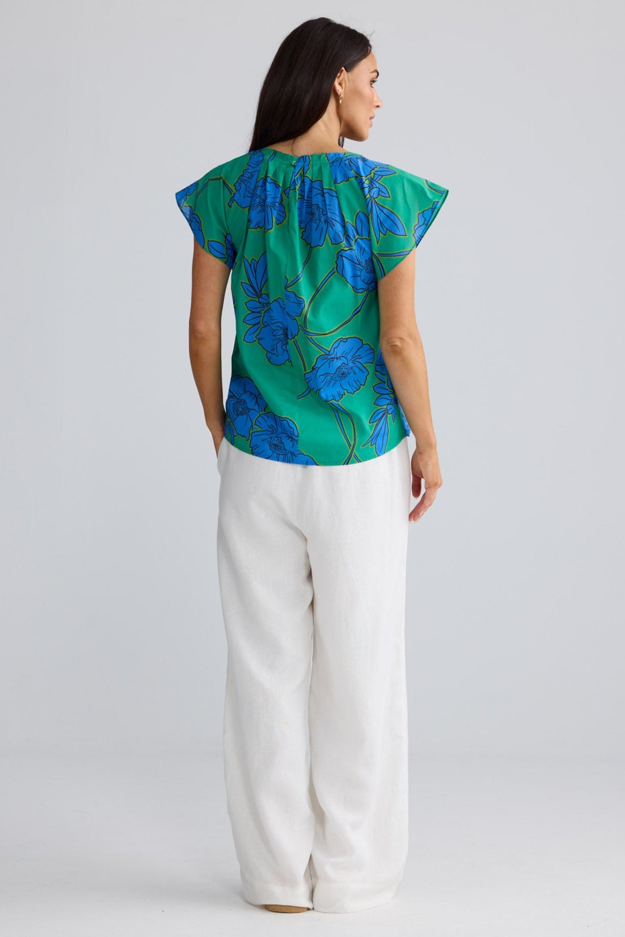 Model wearing Boulevard Top in Bloomsbury Floral print by Brave + True, front view.